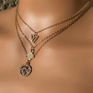 Gold Layered Necklace With Sparkling Charms
